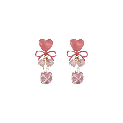 Adorables pendientes de cuentas con forma de ojo de gato y corazón rosa en plata de ley