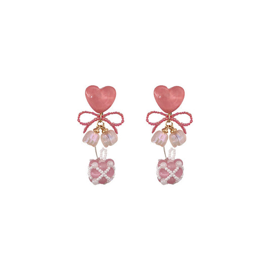 Adorables pendientes de cuentas con forma de ojo de gato y corazón rosa en plata de ley