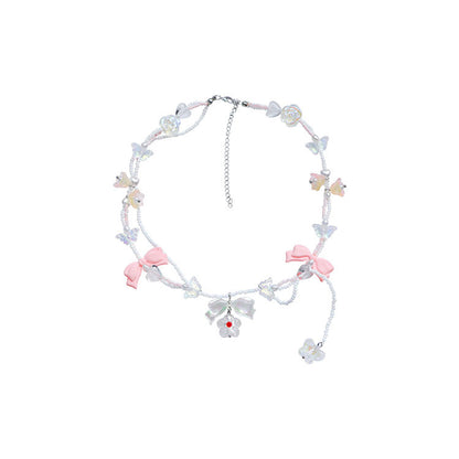 Collar hecho a mano con cuentas de cristal y perlas brillantes con lazo de mariposa