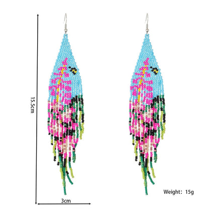 Pendientes de cuentas hechos a mano con borlas y flores coloridas para vacaciones