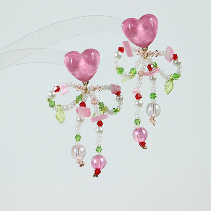 Pendientes de cuentas de corazón rosa con lazo de mariposa de colores en plata de ley